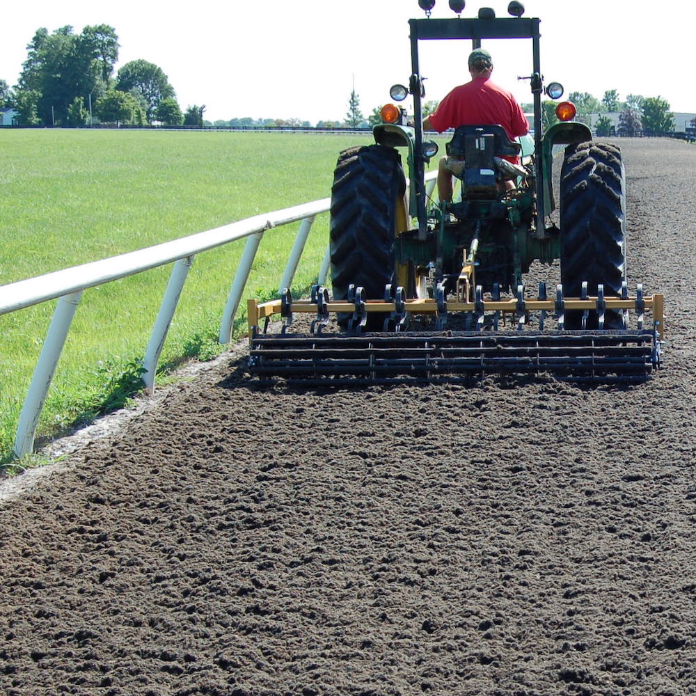 ArenaVator working on a race track